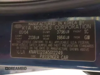 2004 Kia Spectra LX with VIN KNAFE121145012249, listed as a IAAI auction lot 42032571 with 146,748 mi miles. Bid and sale history available at carsss.com. Image 9.