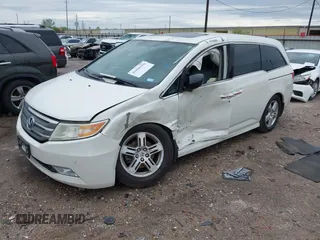 2013 Honda Odyssey Touring with VIN 5FNRL5H96DB074819, listed as a IAAI auction lot 41898358 with 123,428 mi miles and . Bid and sale history available at carsss.com. Image 17.