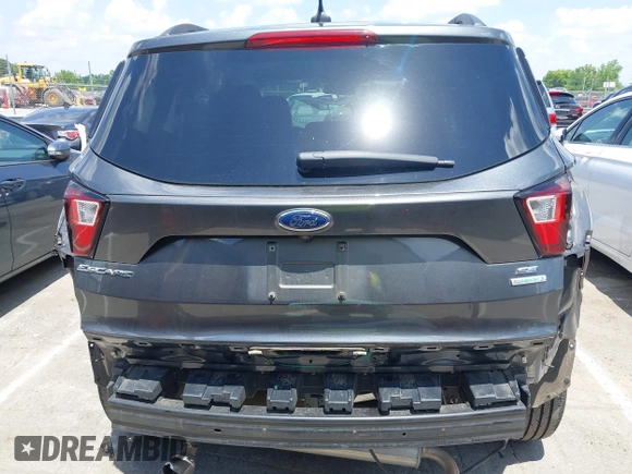 2019 Ford Escape SE z VIN 1FMCU0GD0KUB74569, wystawiony jako IAAI lot #42271476 z przebiegiem 66 335 mil mil oraz . Historia ofert i sprzedaży dostępna na DreamBid. Obrazek 6.