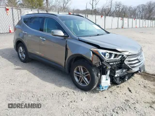 2018 Hyundai Santa Fe 2.4L z VIN 5NMZUDLB9JH066323, wystawiony jako IAAI lot #41768191 z przebiegiem 79 355 mil mil oraz . Historia ofert i sprzedaży dostępna na DreamBid. Obrazek 1.