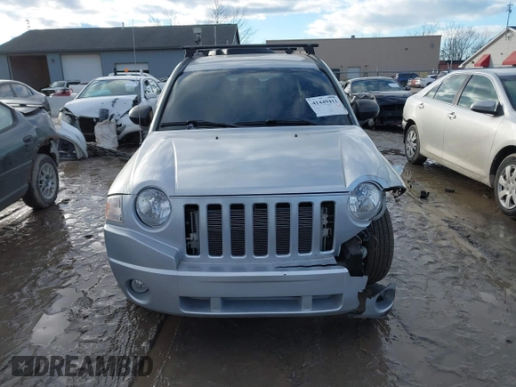 2010 Jeep Compass Sport with VIN 1J4NF4FB3AD589361, listed as a IAAI auction lot 41449412 with 127,807 mi miles. Bid and sale history available at carsss.com. Image 11.