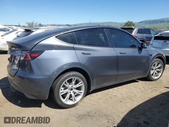 2022 Tesla Model Y Long Range with VIN 7SAYGDEE2NF402320, listed as a Copart auction lot 50396605 with 27,426 mi miles and Salvage Title. Bid and sale history available at DreamBid. Image 3.