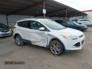 2013 Ford Escape SEL with VIN 1FMCU0H99DUB83641, listed as a IAAI auction lot 41578882 with 124,872 mi miles. Bid and sale history available at carsss.com. Image 1.