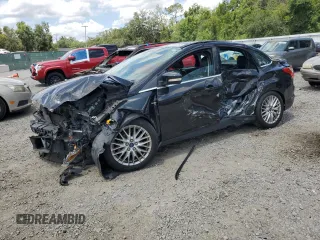 2014 Ford Focus Titanium with VIN 1FADP3J29EL240450, listed as a Copart auction lot 59528365 with 116,764 mi miles and Salvage title. Bid and sale history available at DreamBid. Image 1.