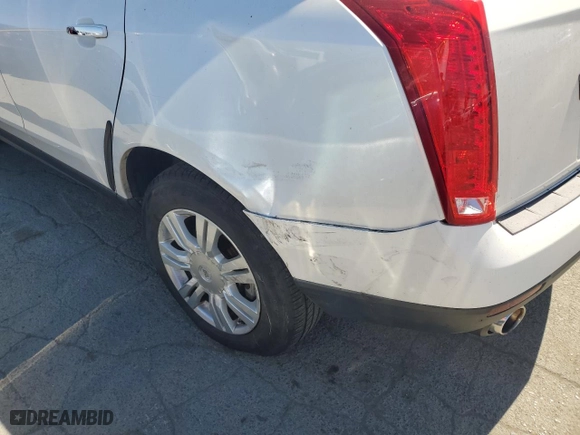 2012 Cadillac SRX with VIN 3GYFNGE33CS600199, listed as a Copart auction lot 69927134 with 117,963 mi miles and Salvage Title. Bid and sale history available at carsss.com. Image 9.