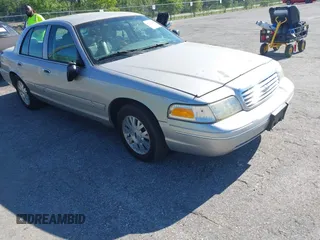 2005 Ford Crown Victoria LX z VIN 2FAFP74W65X162579, wystawiony jako IAAI lot #42038192 z przebiegiem 123 255 mil mil oraz . Historia ofert i sprzedaży dostępna na DreamBid. Obrazek 1.