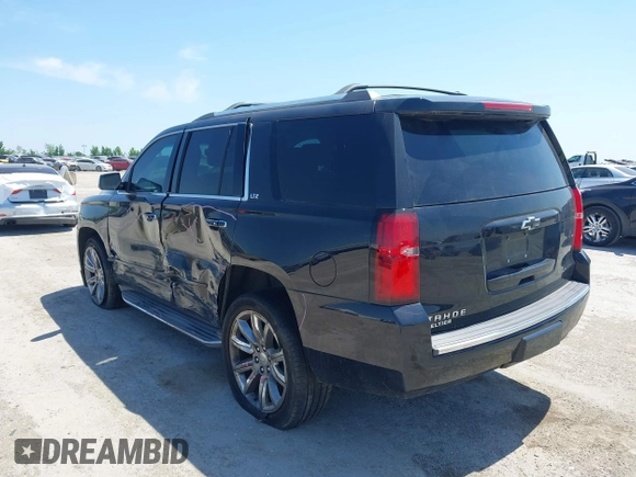 2015 Chevrolet Tahoe LTZ with VIN 1GNSCCKC4FR309152, listed as a IAAI auction lot 42029341 with 187,313 mi miles and . Bid and sale history available at DreamBid. Image 3.