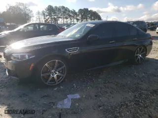 2015 BMW M5 with VIN WBSFV9C5XFD594551, listed as a Copart auction lot 84474684 with 24,890 mi miles and Salvage Title. Bid and sale history available at carsss.com. Image 1.