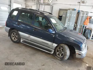 2001 Chevrolet Tracker LT z VIN 2CNBJ634116945339, wystawiony jako IAAI lot #42028762 z przebiegiem 103 032 mil mil oraz . Historia ofert i sprzedaży dostępna na DreamBid. Obrazek 1.