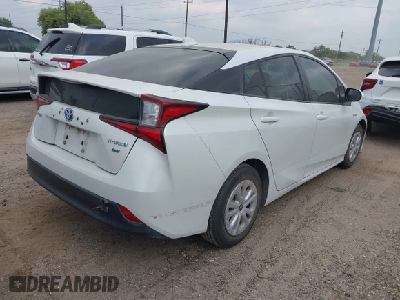 2021 Toyota Prius L Eco with VIN JTDKAMFU5M3132103, listed as a IAAI auction lot 42061511 with 42,116 mi miles and . Bid and sale history available at DreamBid. Image 4.