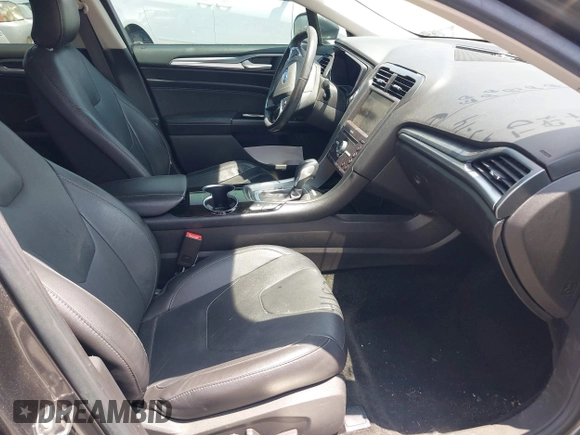 2016 Ford Fusion Titanium with VIN 3FA6P0SU1GR304590, listed as a IAAI auction lot 42381545 with 136,684 mi miles and . Bid and sale history available at DreamBid. Image 5.