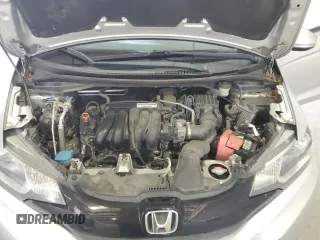 2015 Honda Fit LX z VIN 3HGGK5H52FM717304, wystawiony jako Copart lot #60466295 z przebiegiem 130 422 mil mil oraz Szkoda całkowita • Salvage title. Historia ofert i sprzedaży dostępna na DreamBid. Obrazek 11.