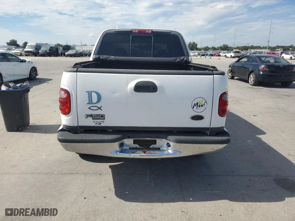 2001 Ford F-150 SuperCrew XLT with VIN 1FTRW07W41KE02772, listed as a Copart auction lot 73586724 with 0 mi miles and Salvage Title. Bid and sale history available at carsss.com. Image 6.
