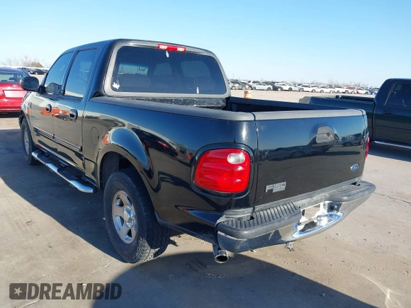 2002 Ford F-150 XLT with VIN 1FTRW07622KD31203, listed as a IAAI auction lot 41401506 with 166,949 mi miles. Bid and sale history available at carsss.com. Image 3.