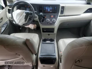 2015 Toyota Sienna LE with VIN 5TDJK3DCXFS126604, listed as a Copart auction lot 56987355 with 102,079 mi miles and Salvage title. Bid and sale history available at DreamBid. Image 8.