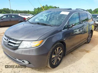 2015 Honda Odyssey Touring Elite z VIN 5FNRL5H97FB060981, wystawiony jako IAAI lot #42289631 z przebiegiem 160 947 mil mil oraz . Historia ofert i sprzedaży dostępna na DreamBid. Obrazek 19.