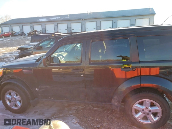 2007 Dodge Nitro SLT with VIN 1D8GU58K27W549214, listed as a IAAI auction lot 41358109 with 99,530 mi miles. Bid and sale history available at carsss.com. Image 14.