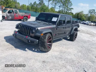 2020 Jeep Gladiator Rubicon with VIN 1C6JJTBG0LL187537, listed as a IAAI auction lot 42018914 with 53,443 mi miles and . Bid and sale history available at DreamBid. Image 2.