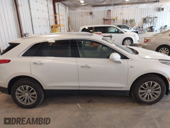 2018 Cadillac XT5 Luxury AWD z VIN 1GYKNDRS9JZ248969, wystawiony jako IAAI lot #42463156 z przebiegiem 90 271 mil mil oraz . Historia ofert i sprzedaży dostępna na DreamBid. Obrazek 13.