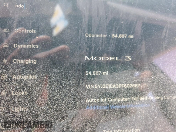 2023 Tesla Model 3 with VIN 5YJ3E1EA3PF602067, listed as a Copart auction lot 52317695 with 54,867 mi miles and Salvage Title. Bid and sale history available at DreamBid. Image 9.