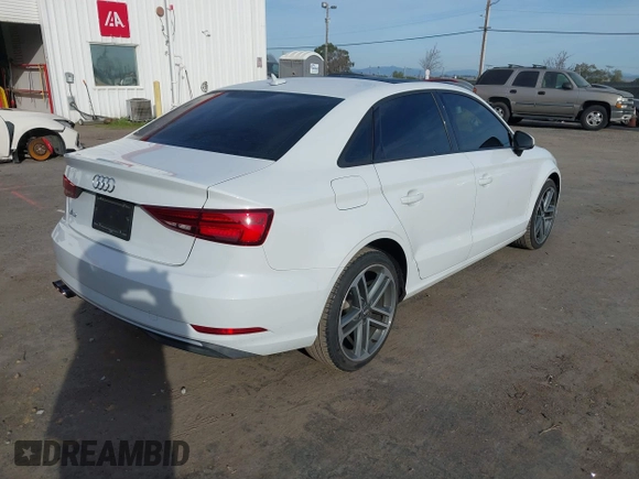 2018 Audi A3 Sedan Premium with VIN WAUAUGFF7J1069760, listed as a IAAI auction lot 41687581 with 70,980 mi miles. Bid and sale history available at carsss.com. Image 4.