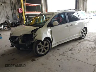 2014 Toyota Sienna SE with VIN 5TDXK3DC7ES497390, listed as a IAAI auction lot 42037096 with 169,127 mi miles and . Bid and sale history available at DreamBid. Image 2.