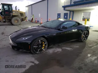 2023 Aston Martin DB11 z VIN SCFRMFAV3PGL11773, wystawiony jako Copart lot #82879093 z przebiegiem Nie podano mil oraz . Historia ofert i sprzedaży dostępna na DreamBid. Obrazek 1.