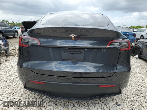 2024 Tesla Model Y with VIN 7SAYGDED2RF040079, listed as a Copart auction lot 57237054 with 2,549 mi miles and Non Repairable. Bid and sale history available at DreamBid. Image 6.