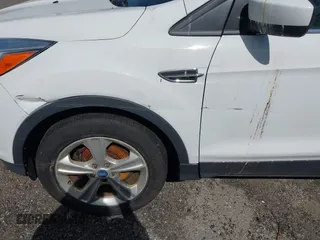 2013 Ford Escape SE with VIN 1FMCU0GXXDUA73875, listed as a IAAI auction lot 42164115 with 195,712 mi miles and . Bid and sale history available at carsss.com. Image 6.