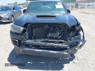 2019 Toyota Tacoma SR with VIN 5TFCZ5AN4KX208354, listed as a IAAI auction lot 42771410 with 77,509 mi miles and . Bid and sale history available at DreamBid. Image 6.