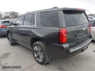 2015 Chevrolet Tahoe LTZ with VIN 1GNSCCKC7FR614886, listed as a IAAI auction lot 41679585 with 104,695 mi miles. Bid and sale history available at carsss.com. Image 3.