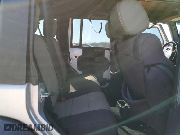 2010 Jeep Wrangler Unlimited Rubicon with VIN 1J4BA6H12AL107485, listed as a Copart auction lot 48802825 with 123,299 mi miles and Salvage title. Bid and sale history available at DreamBid. Image 11.