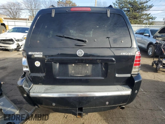 2005 Mercury Mariner Luxury z VIN 4M2CU57185DJ15517, wystawiony jako Copart lot #44415385 z przebiegiem 129 177 mil mil oraz Szkody całkowita. Historia ofert i sprzedaży dostępna na DreamBid. Obrazek 6.
