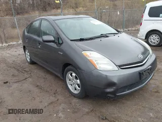 2007 Toyota Prius z VIN JTDKB20U673217594, wystawiony jako IAAI lot #42010043 z przebiegiem 151 461 mil mil oraz . Historia ofert i sprzedaży dostępna na DreamBid. Obrazek 1.