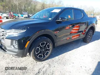 2023 Hyundai Santa Cruz SEL z VIN 5NTJBDAE1PH070024, wystawiony jako IAAI lot #41995937 z przebiegiem 43 757 mil mil oraz . Historia ofert i sprzedaży dostępna na DreamBid. Obrazek 2.