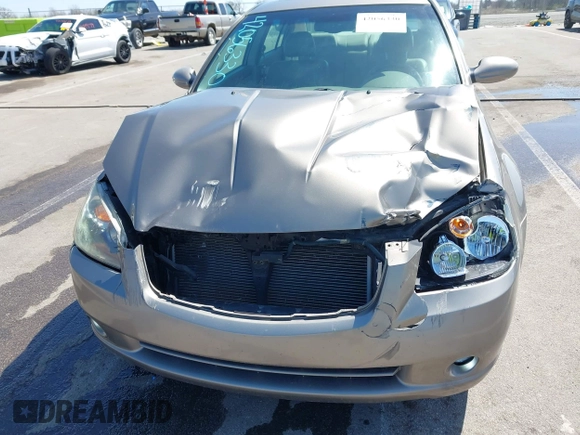 2005 Nissan Altima SE z VIN 1N4BL11D65C148642, wystawiony jako IAAI lot #42056330 z przebiegiem 81 328 mil mil oraz . Historia ofert i sprzedaży dostępna na DreamBid. Obrazek 6.