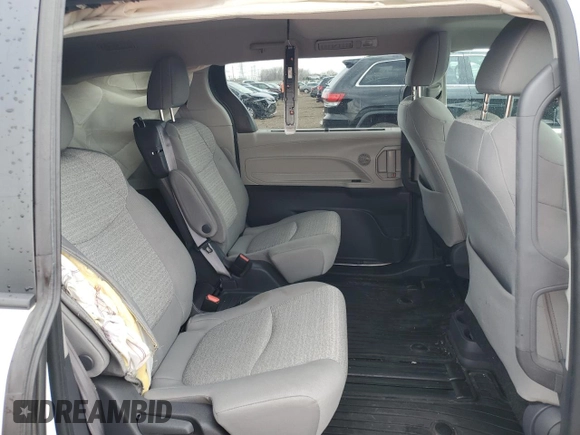 2021 Toyota Sienna LE z VIN 5TDBSKFC4MS022005, wystawiony jako Copart lot #50769965 z przebiegiem 108 694 mil mil oraz Szkoda całkowita • Salvage title. Historia ofert i sprzedaży dostępna na DreamBid. Obrazek 11.