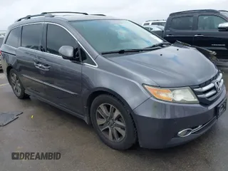 2015 Honda Odyssey Touring Elite with VIN 5FNRL5H91FB096679, listed as a IAAI auction lot 41710382 with 113,096 mi miles and . Bid and sale history available at DreamBid. Image 1.