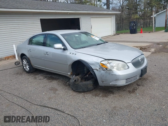 2009 Buick Lucerne CXL with VIN 1G4HD57M79U141033, listed as a IAAI auction lot 42061042 with 161,021 mi miles. Bid and sale history available at carsss.com. Image 1.