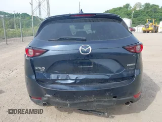 2021 Mazda CX-5 Touring z VIN JM3KFBCMXM0389857, wystawiony jako IAAI lot #42309650 z przebiegiem 49 938 mil mil oraz . Historia ofert i sprzedaży dostępna na DreamBid. Obrazek 16.