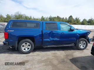 2017 Chevrolet Silverado 1500 LT with VIN 3GCUKREC5HG363503, listed as a IAAI auction lot 41833304 with 133,130 mi miles and . Bid and sale history available at DreamBid. Image 12.