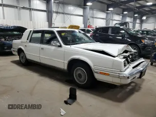 1991 Chrysler New Yorker z VIN 1C3XY66R1MD290977, wystawiony jako Copart lot #83359124 z przebiegiem 98 611 mil mil oraz Szkody całkowita. Historia ofert i sprzedaży dostępna na DreamBid. Obrazek 4.
