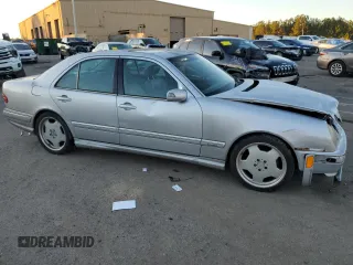 2000 Mercedes-Benz E-Class with VIN WDBJF70JXYB113988, listed as a Copart auction lot 86325514 with 198,321 mi miles and Salvage Title. Bid and sale history available at carsss.com. Image 4.