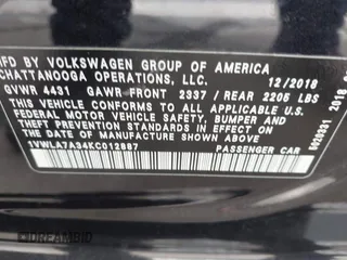 2019 Volkswagen Passat 2.0T Wolfsburg Edition with VIN 1VWLA7A34KC012887, listed as a IAAI auction lot 41792604 with 70,237 mi miles. Bid and sale history available at carsss.com. Image 9.