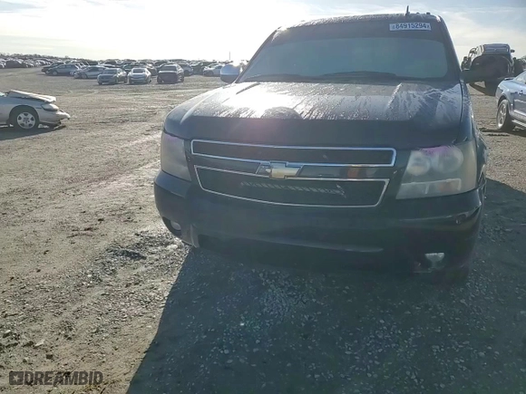2009 Chevrolet Suburban LT w/2LT with VIN 1GNFC26069R297182, listed as a Copart auction lot 84915294 with 221,946 mi miles and Salvage Title. Bid and sale history available at carsss.com. Image 11.