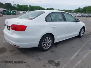 2014 Volkswagen Jetta Sedan SE w/Connectivity/Sunroof PZEV with VIN 3VWD17AJ5EM326425, listed as a IAAI auction lot 42066054 with 125,004 mi miles. Bid and sale history available at carsss.com. Image 4.