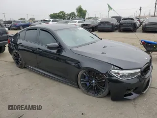 2020 BMW M5 z VIN WBSJF0C02LCE10800, wystawiony jako Copart lot #60674545 z przebiegiem Nie podano mil oraz Szkoda całkowita • Salvage title. Historia ofert i sprzedaży dostępna na DreamBid. Obrazek 4.