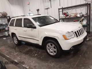 2010 Jeep Grand Cherokee Laredo with VIN 1J4PR4GK1AC143486, listed as a IAAI auction lot 41761763 with 159,139 mi miles. Bid and sale history available at carsss.com. Image 1.