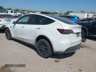 2021 Tesla Model Y Long Range with VIN 5YJYGDEE0MF265339, listed as a IAAI auction lot 41975058 with 51,292 mi miles and . Bid and sale history available at DreamBid. Image 3.