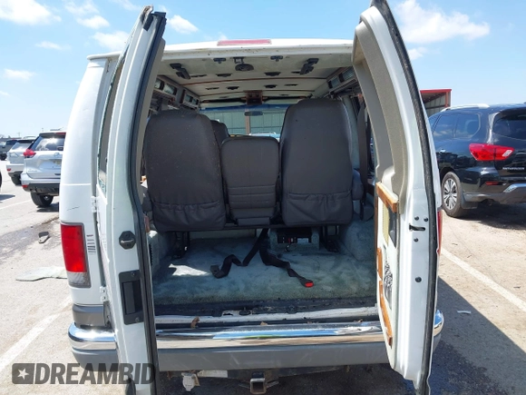 1999 Ford Econoline Cargo Recreational with VIN 1FDRE14L2XHA41059, listed as a IAAI auction lot 42067879 with 149,185 mi miles. Bid and sale history available at carsss.com. Image 19.